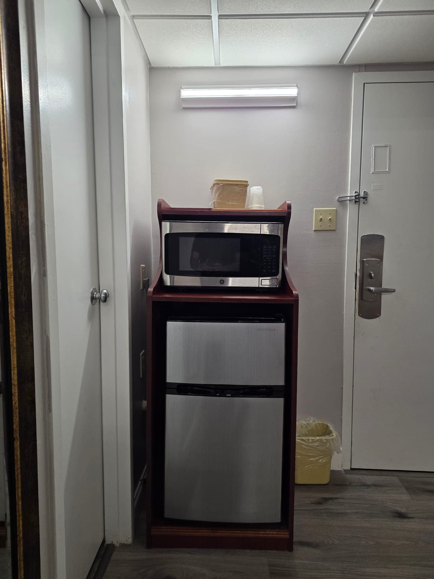 Saffron Inn in-room microwave and mini-fridge alcove with countertop and drawer storage