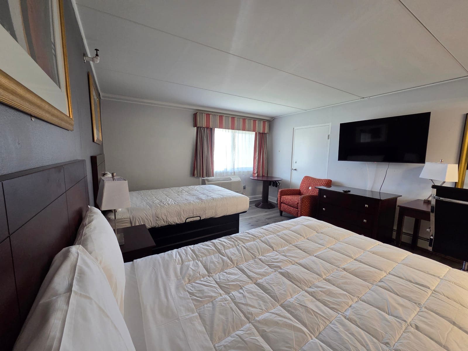 Saffron Inn two-queen ground-floor room — view showing the work desk, granite countertop, and floor lamp