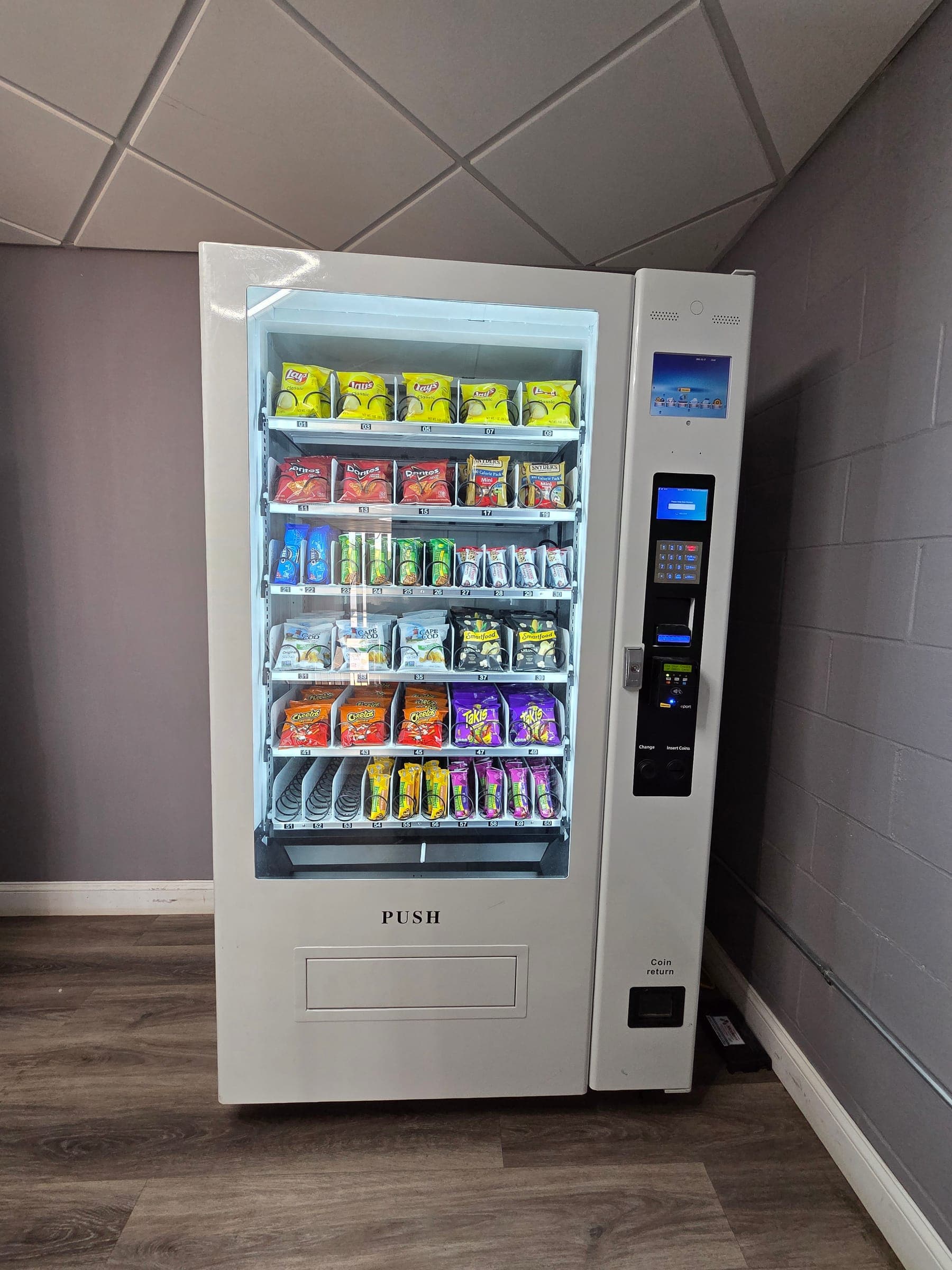 Saffron Inn on-site snack vending machine available 24/7